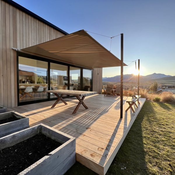 Outdoor space covered with a retractable shade sail by Cool Awnings, combining style and functional sun protection.