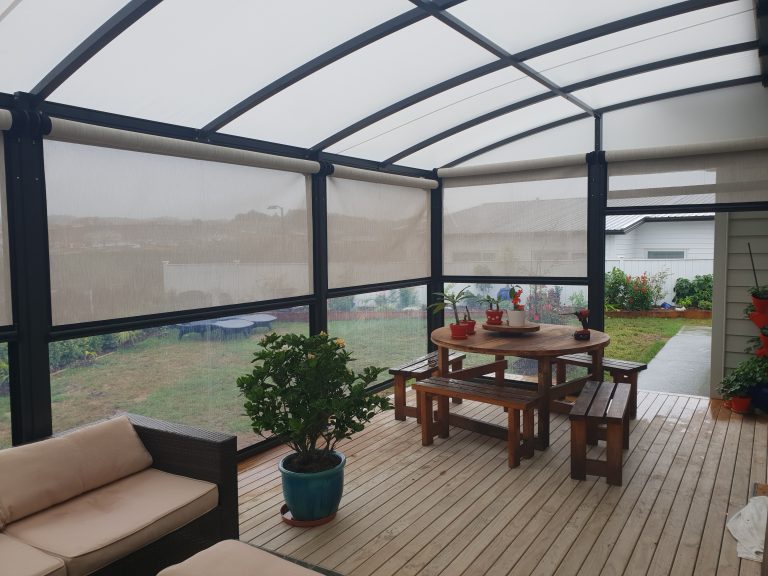Deck covered by a Cool Awnings fixed frame awning, combining functional shade with stylish exterior design.