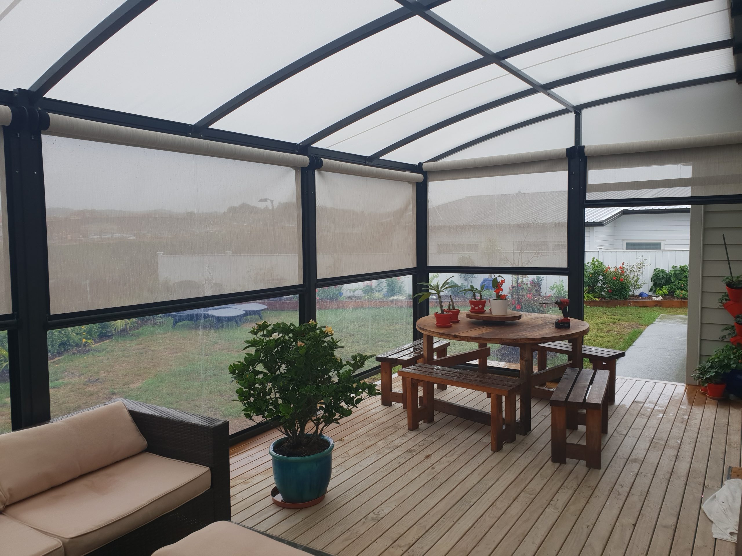 Deck covered by a Cool Awnings fixed frame awning, combining functional shade with stylish exterior design.
